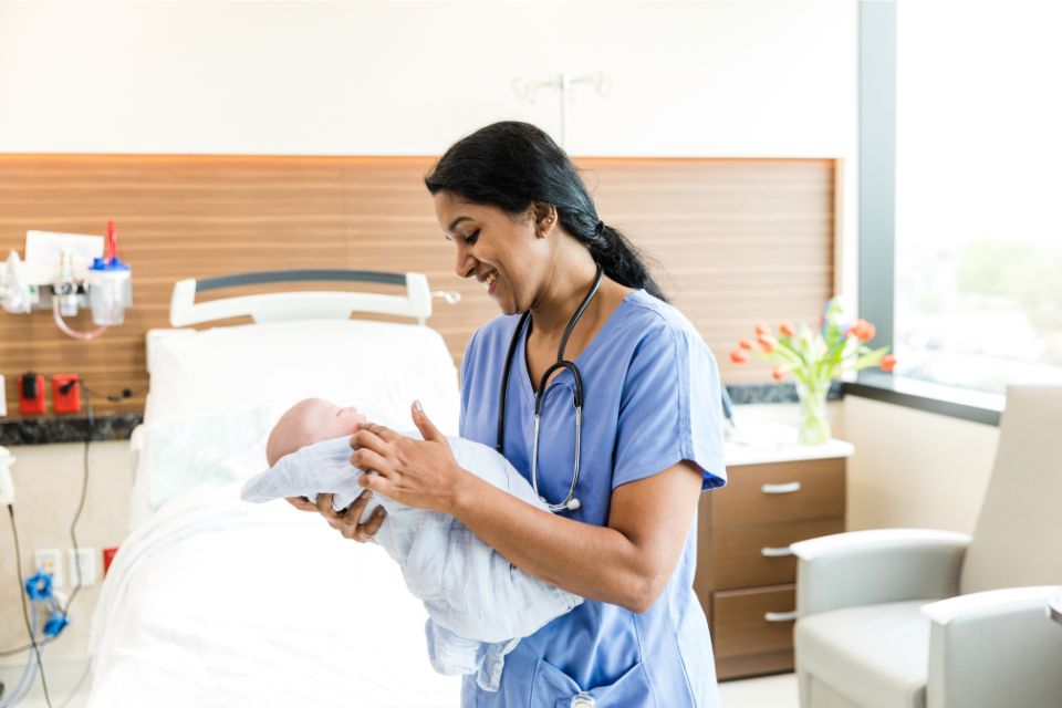 Midwife working with a mother